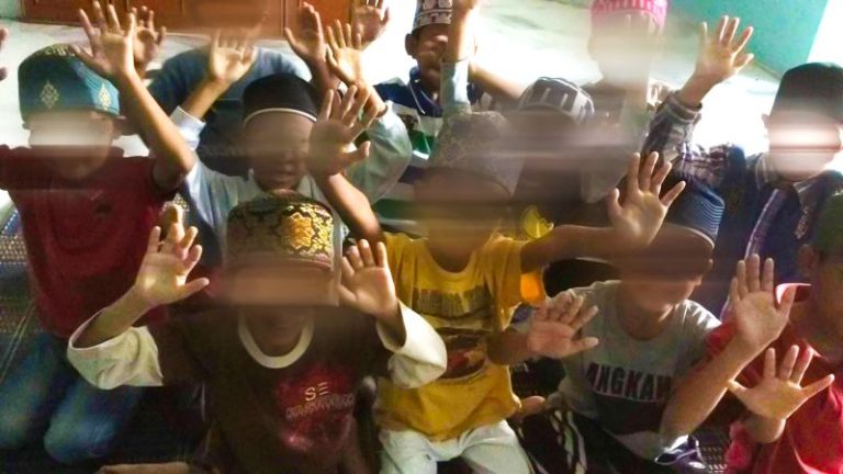 In public, they ran a successful global business. In private, police allege they abused hundreds of children